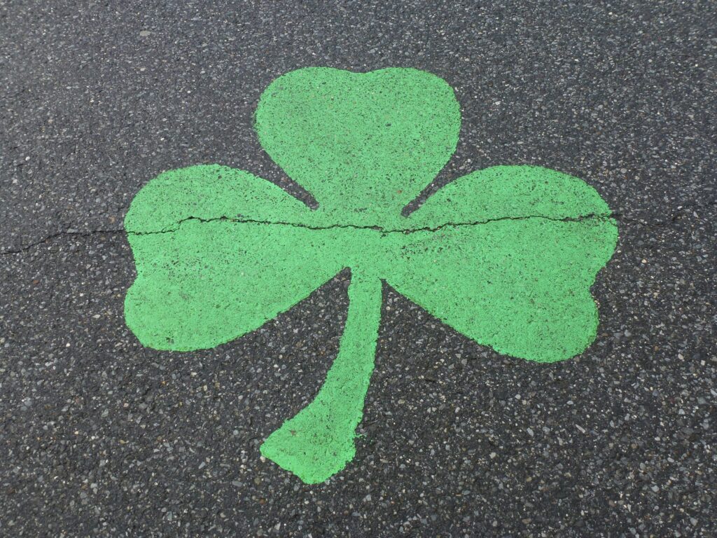 Irish shamrock painted on pavement.